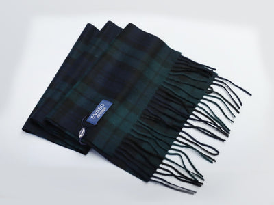 Premium Mongolian cashmere scarf in green and black plaid pattern with fringed edges and EVSEG label.