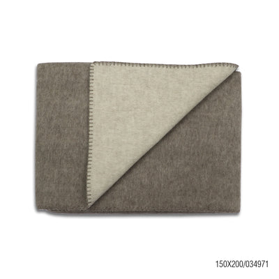 A high-quality sheep and yak wool blanket in a brown and beige dual tone, neatly folded to showcase its soft texture, premium stitching, and elegant craftsmanship.