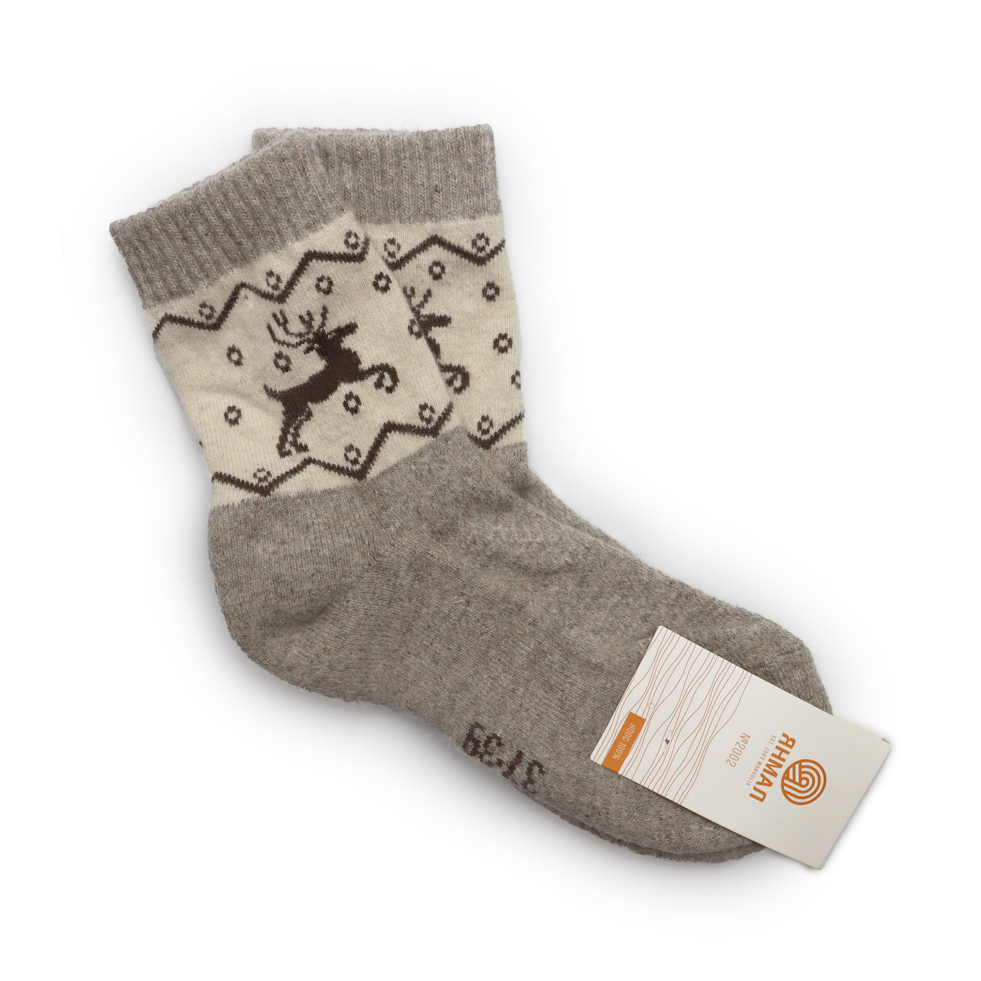 Natural beige wool socks with a black reindeer pattern on the cuffs, made from Mongolian wool for winter comfort and style.