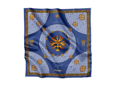 Luxurious blue silk scarf adorned with golden traditional motifs, intricate ornaments, and decorative patterns, exuding elegance and sophistication.