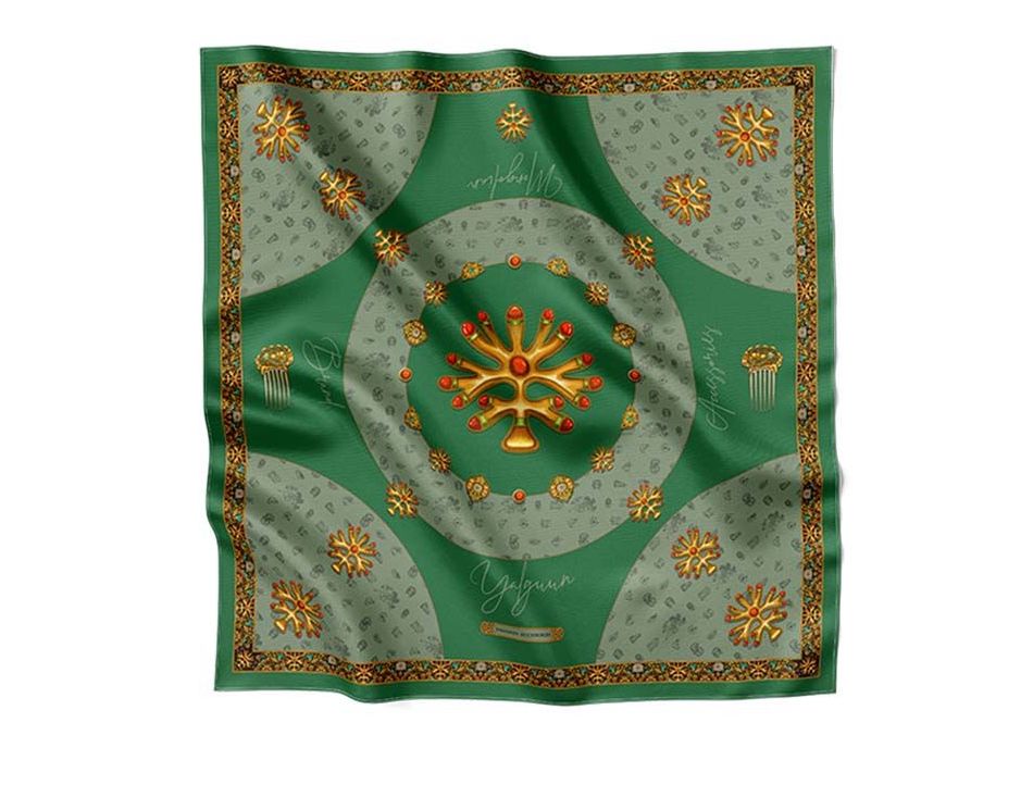 Luxurious green silk scarf adorned with golden traditional motifs, intricate ornaments, and decorative patterns, exuding elegance and sophistication.