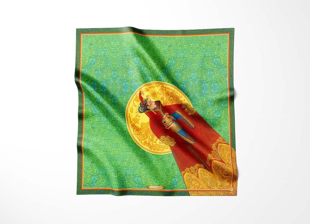 Luxurious silk scarf featuring a traditional Mongolian design with vibrant colors, intricate golden patterns, and a central figure on a green background.