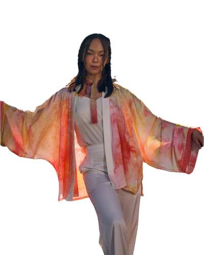 Mongolian traditional vertical written calligraphy silk kimono in warm hues, featuring flowing sleeves and a lightweight, luxurious design.