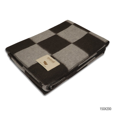 A high-quality checkered wool blanket, featuring a classic design in earthy tones with neatly stitched edges, folded to highlight its soft texture and premium craftsmanship.