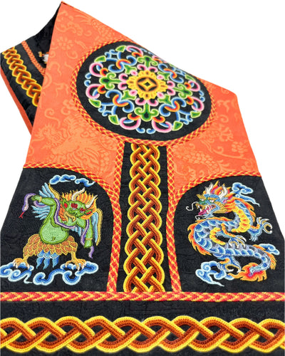 The Four Mighty Creatures, the 12 Zodiac Animals, the Interwoven Pattern, the Five-Eyed Pattern, and the Spiral Pattern are intricately embroidered. The design is finished with fishbone stitching and decorated with a coin braid stitch on a vibrant orange and deep brown silk.