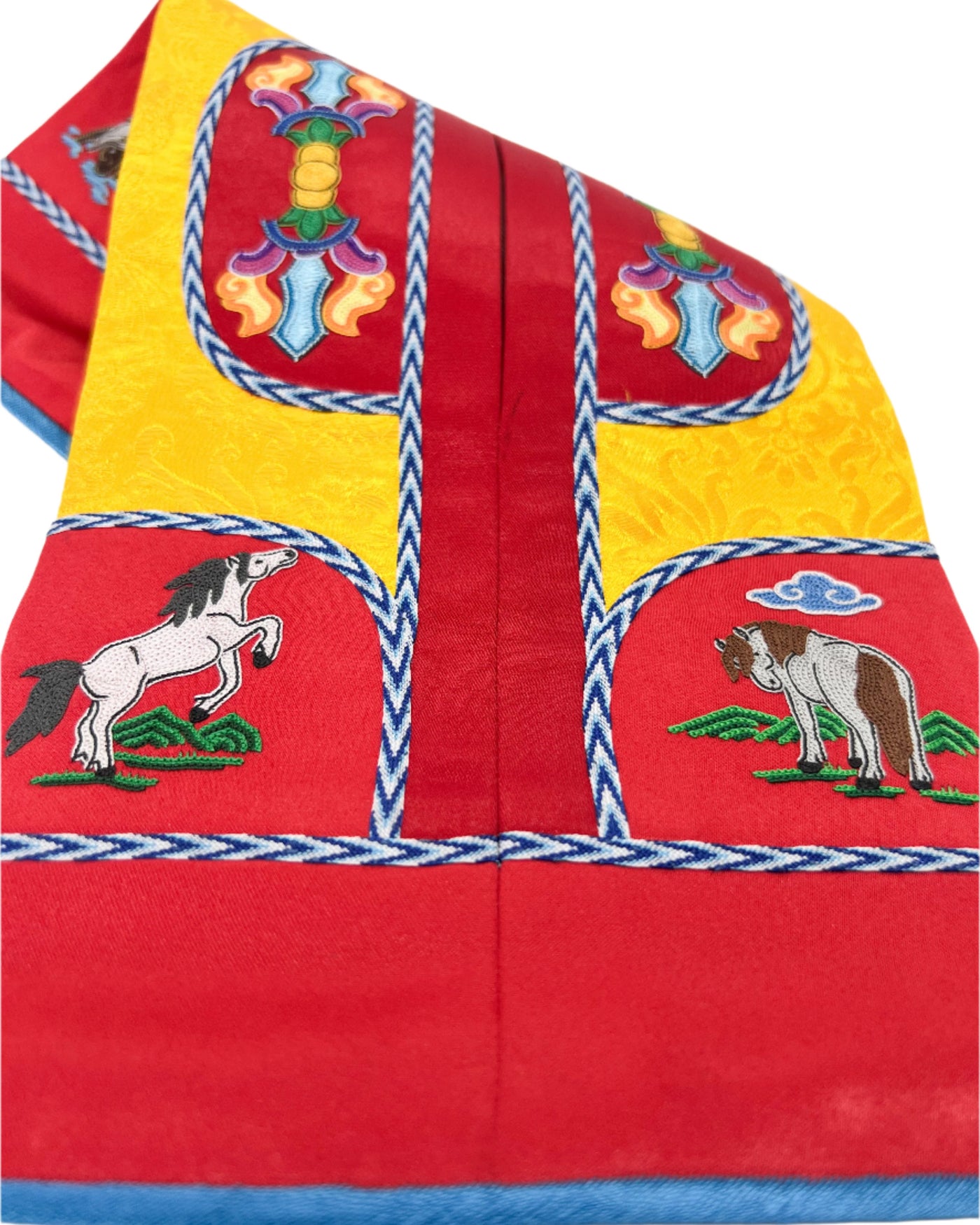 The Spirit Horse, the Vajra, and the Eight Horses of Happiness are intricately embroidered. The design is finished with fishbone stitching and decorated with a coin braid stitch on red and yellow dual tone silk. 