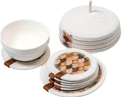 Cup coaster set with intricate patterns and matching holder, designed for protecting surfaces and enhancing décor.
