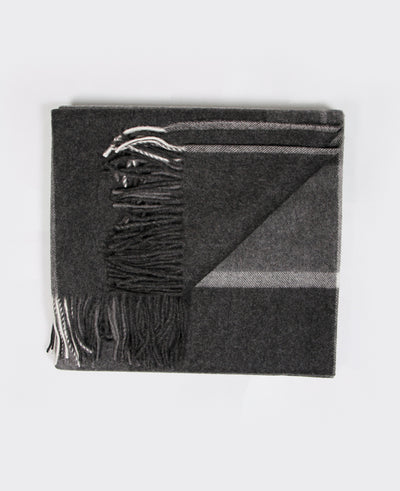 A luxurious dark gray Mongolian cashmere plaid with elegant fringe details, made from 100% sustainable cashmere.