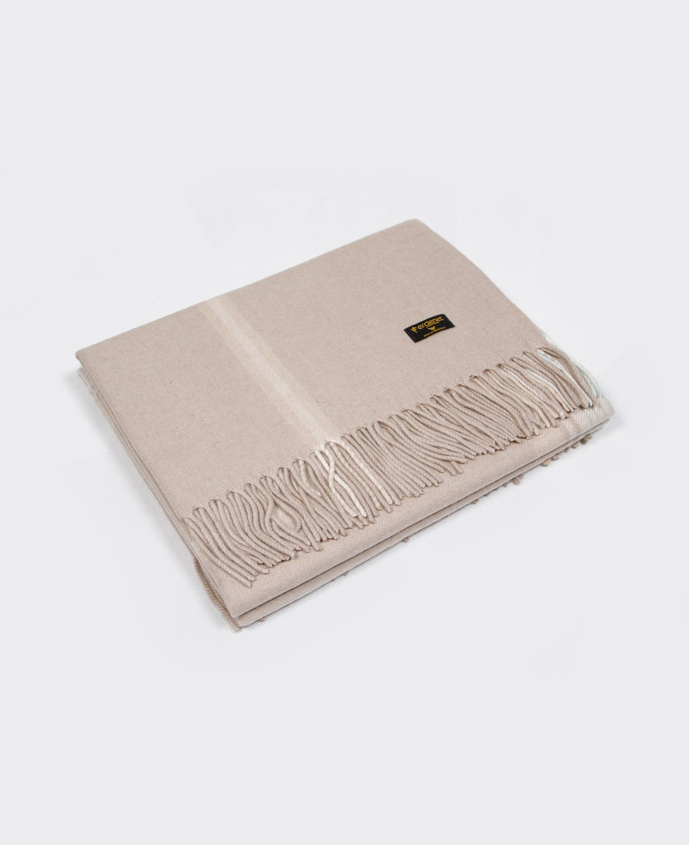 A light beige Mongolian cashmere plaid with fringe detailing, made from 100% sustainable and soft cashmere.