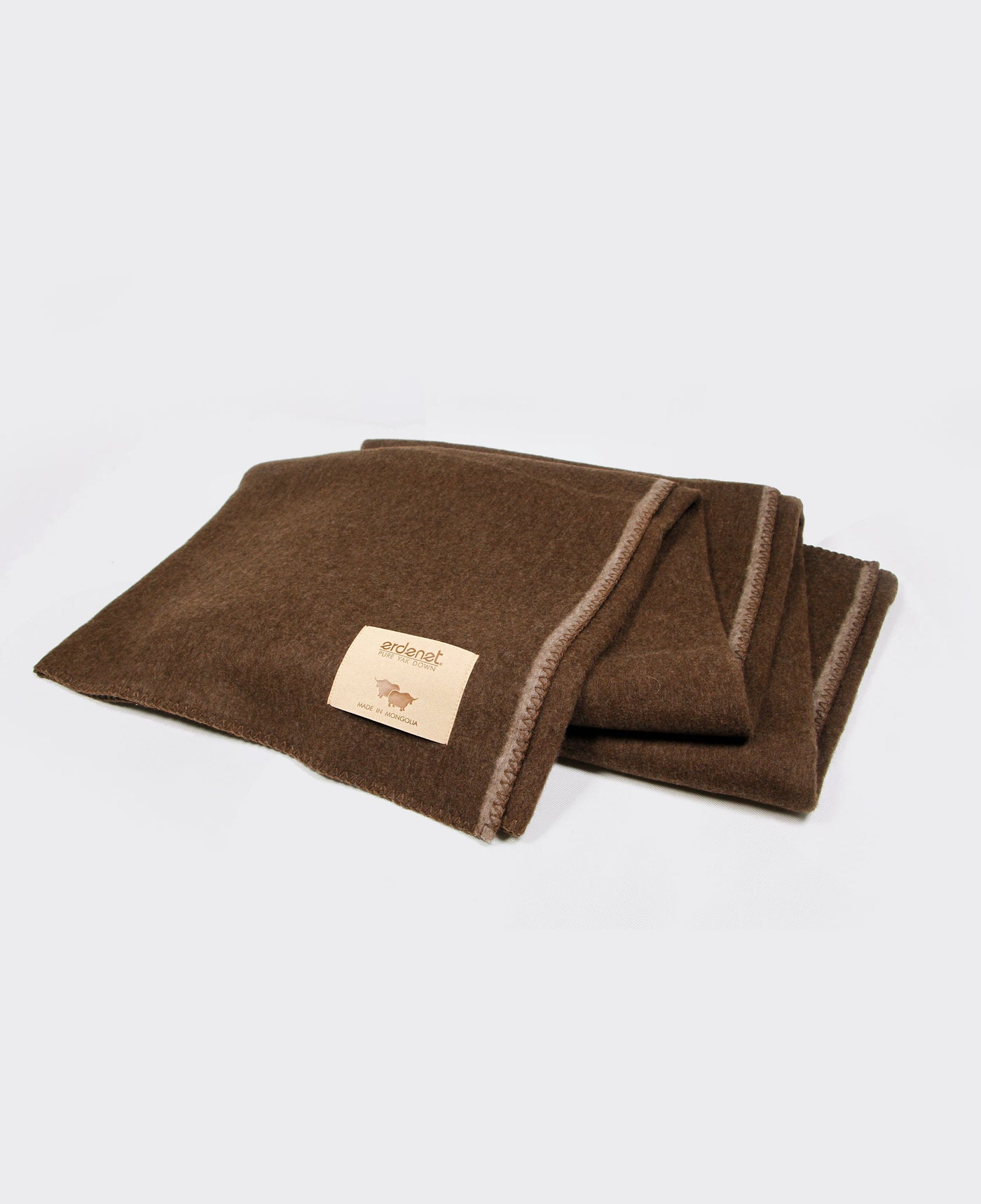 Brown yak wool blanket with stitched edging, made in Mongolia, offering warmth, softness, and sustainability.