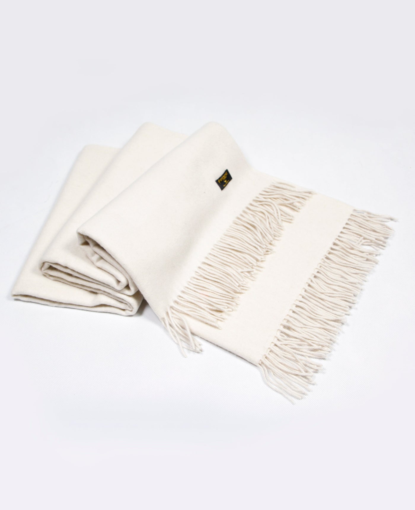 White cashmere  plaid with a red line and fringed edges, sustainably sourced from Mongolia, offering warmth and comfort