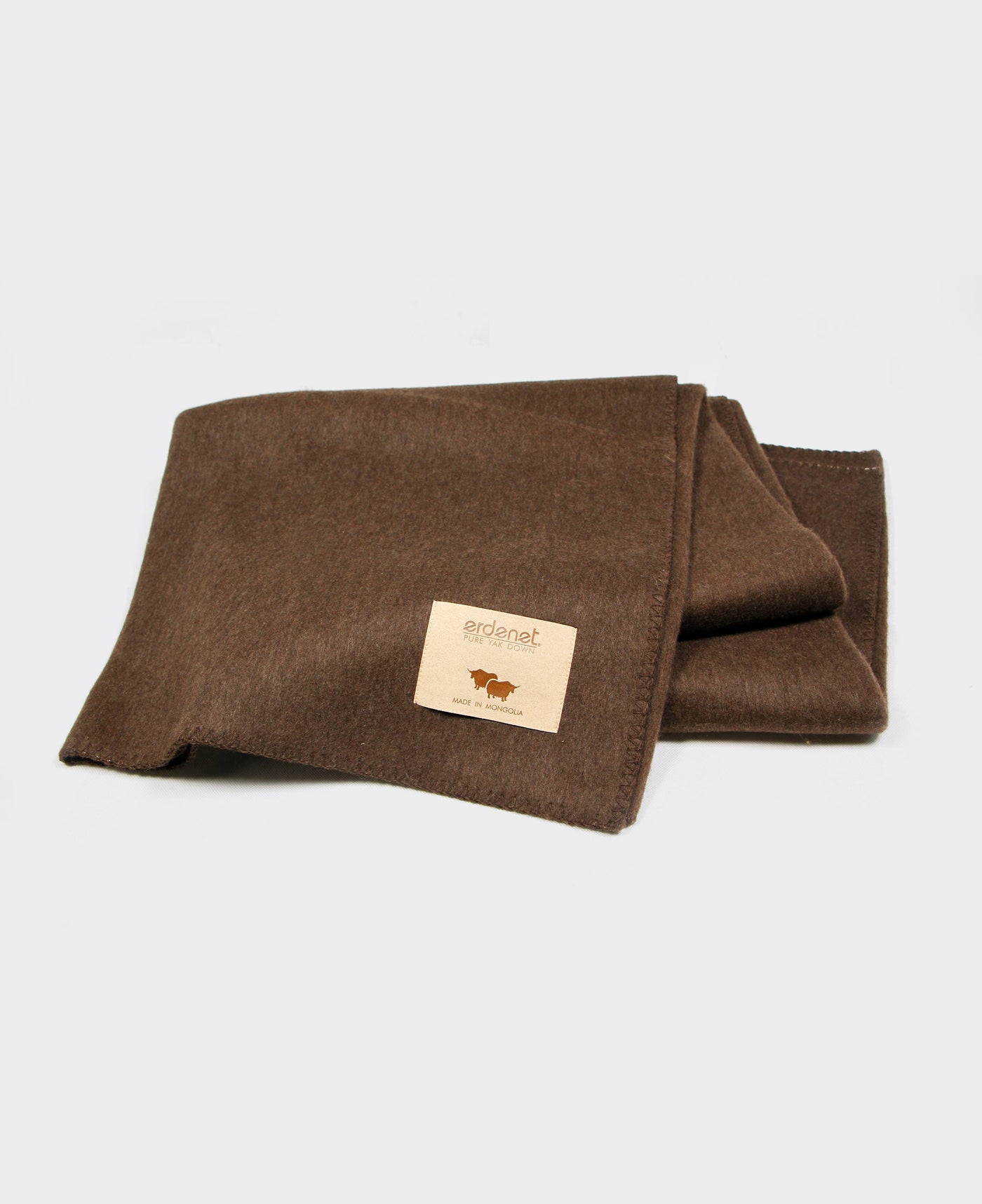 Brown yak wool blanket with stitched edging, made in Mongolia, offering warmth, softness, and sustainability.